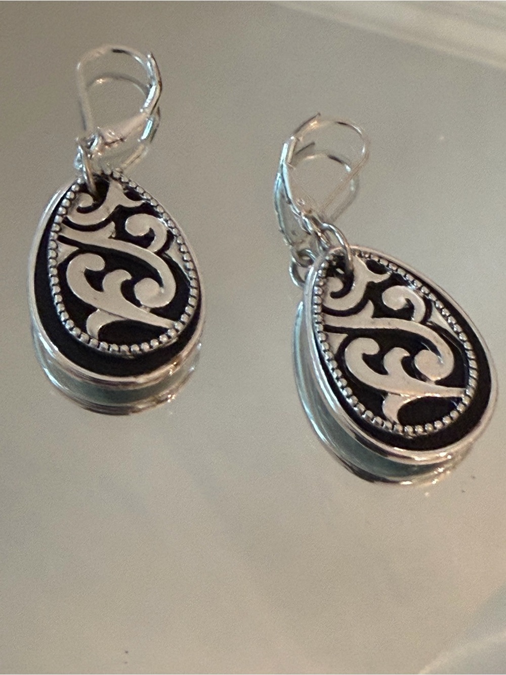 Napier Silver Filigree Teardrop Earrings - Black backing